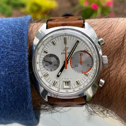 Big Eye with a white dial, grey left register and larger right-hand counter on a tan strap, on the wrist