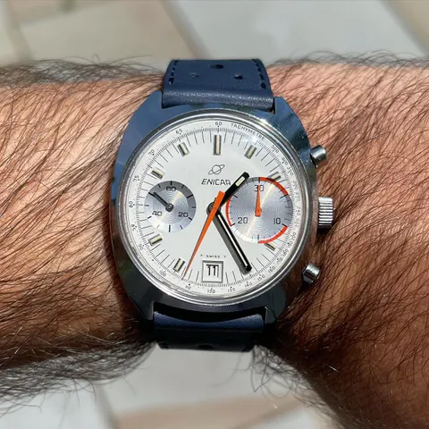 Big Eye with a white dial and larger right-hand counter on a navy strap, on the wrist