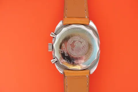 Caseback of a Big Eye chronograph on a tan strap
