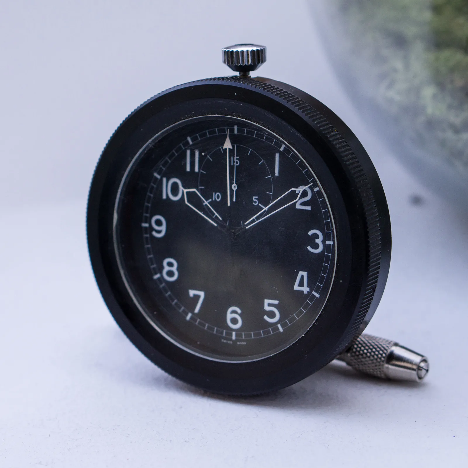 817 CH cockpit chronograph with a black dial, white Arabic numerals and a 15-minute counter, in its black knurled case