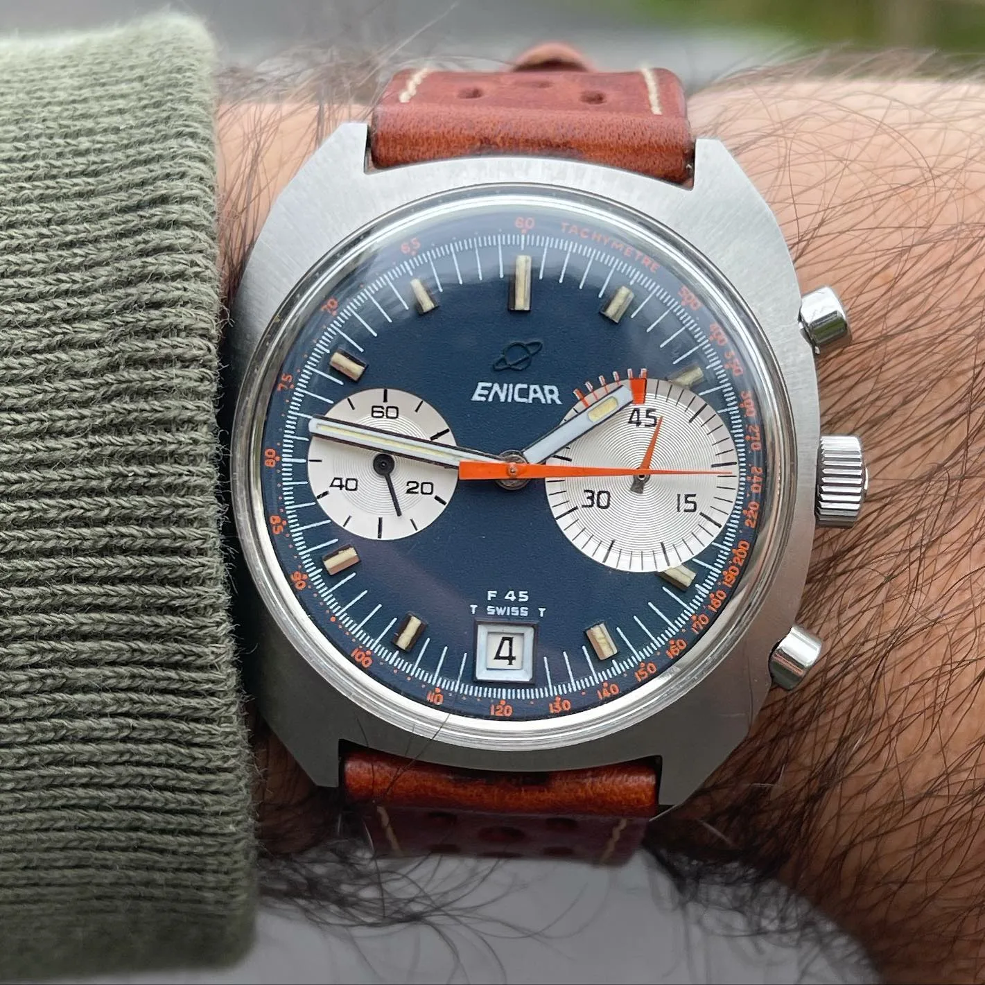 F45 chronograph with a navy dial, white registers and a 45-minute counter on a tan rally strap, on the wrist