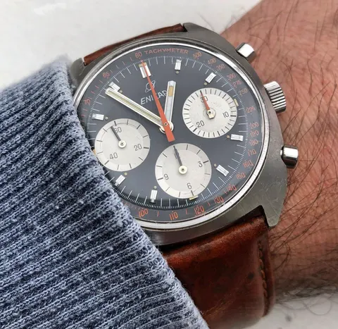 Gerhard Mitter chronograph with a dark grey-blue dial, silver registers and orange chronograph hand in a cushion case, on the wrist