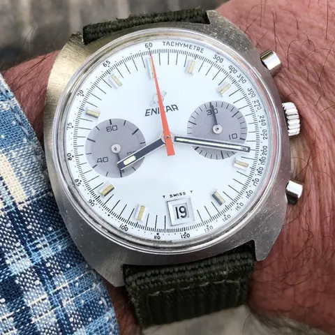 Lausanne chronograph with a white dial, two silver registers and an orange chronograph hand, on the wrist