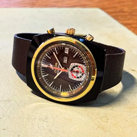 Mantagraph chronograph with a black coated case, gold bezel and brown dial on a dark brown strap