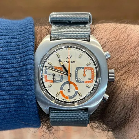 Ocean Pearl chronograph with a white dial, orange chronograph hand and coloured registers, on the wrist
