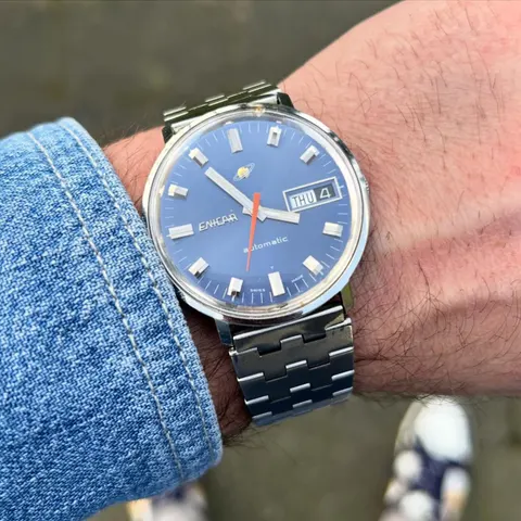 Ocean Pearl with a blue dial and day-date on a steel bracelet, on the wrist