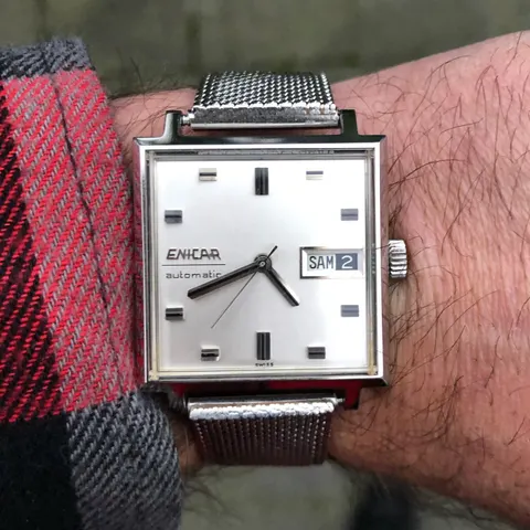 Square Enicar automatic with a silver dial and day-date on a mesh bracelet, on the wrist