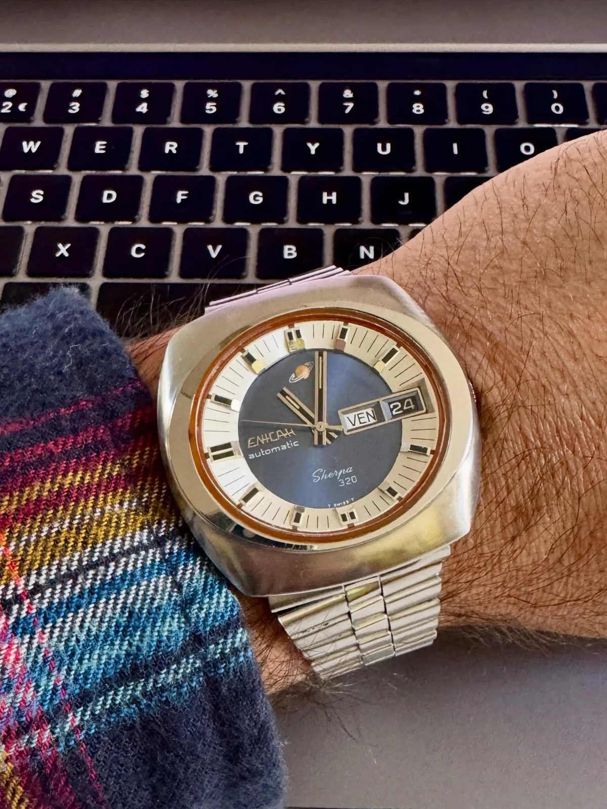 Sherpa 320 with a two-tone grey and cream dial and day-date in an angular case, on the wrist