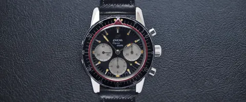 Aqua Graph with a black dial and grey registers, black 60-minute bezel and red ring, on a black leather strap