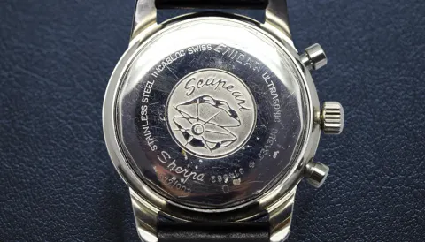Aqua Graph caseback with the Seapearl medallion, on a black strap