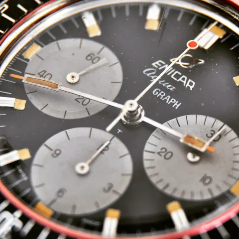 Close-up of an Aqua Graph black dial with grey registers