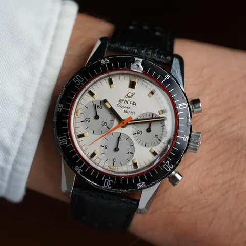 Aqua Graph MkIV with a white dial and grey registers on a black strap, on the wrist