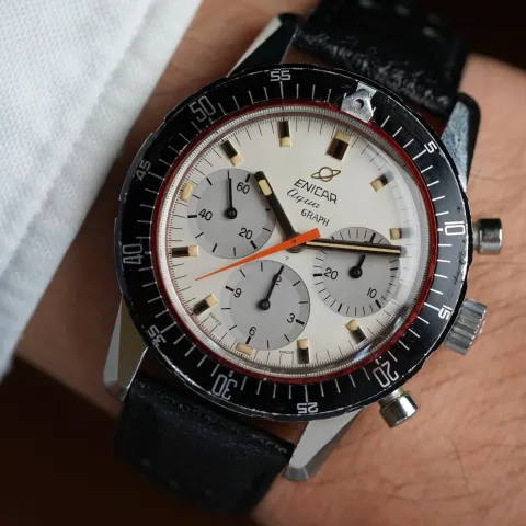 Aqua Graph MkIV with a white dial, grey registers and orange chronograph hand on a black rally strap