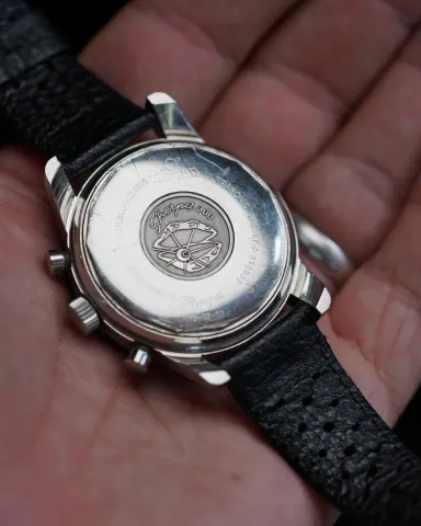 Caseback of an Aqua Graph MkIV, reading Sherpa 300, held in the hand