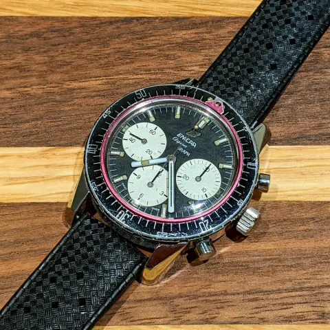 Aqua Graph with a black dial, white registers and baton hands on a black Tropic strap