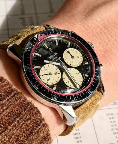 Aqua Graph with a black dial and parchment registers on a tan suede strap
