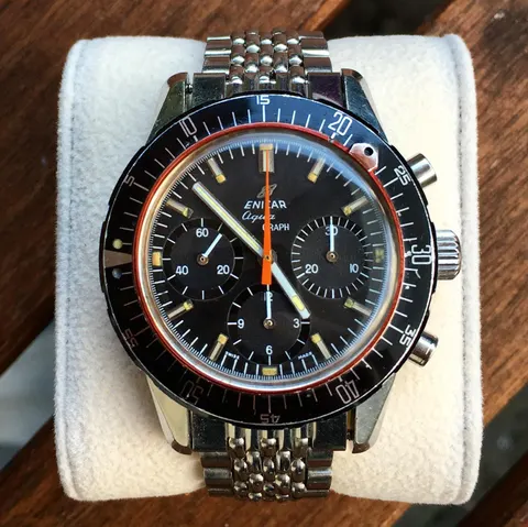 Aqua Graph with a black dial, black registers and orange chronograph hand on a steel bracelet
