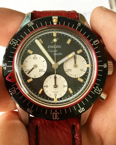 Close view of an Aqua Graph with a black racing dial and white registers