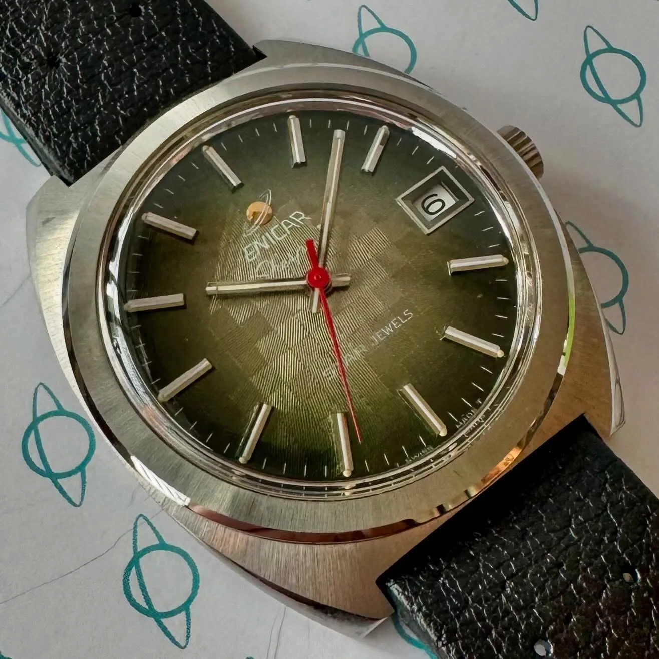 Sherpa D with a green chequered gradient dial, date and red seconds hand