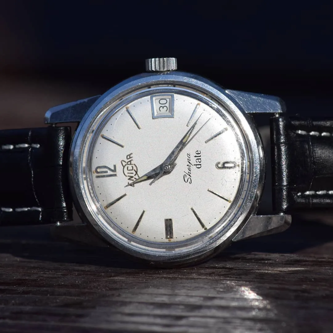 Sherpa Date with a silver dial, applied 12 and 6, and date at 3 on a black leather strap