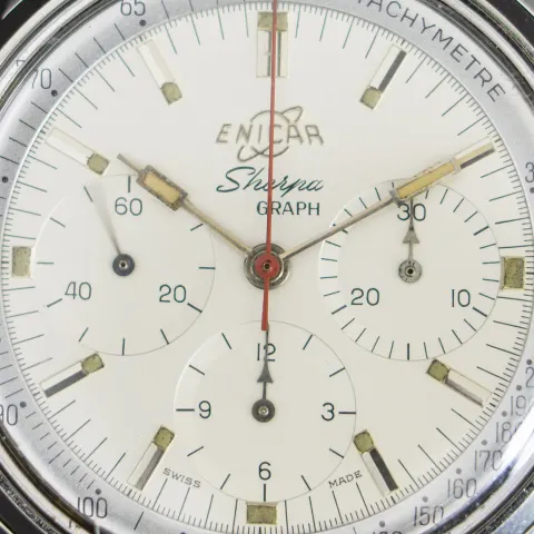 Close-up of a white Sherpa Graph dial with a red chronograph hand and tachymetre ring