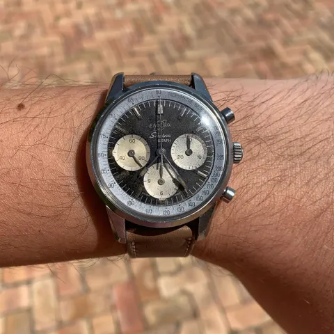 Sherpa Graph MkI with a black dial and white registers on a brown strap, on the wrist