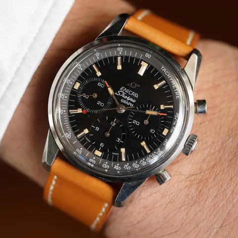 Sherpa Graph MkIII with an all-black dial and grey tachymetre ring on a tan strap, on the wrist