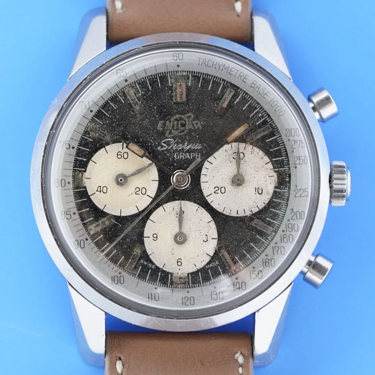 Sherpa Graph MkI with a black dial, cream registers and Tachymetre Base 1000 ring, on a brown strap