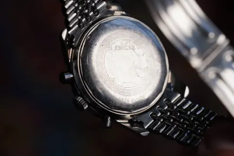 Caseback of a Sherpa Graph MkI on its bracelet