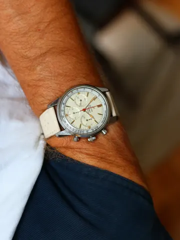 Sherpa Graph with a cream dial on a cream racing strap, on the wrist