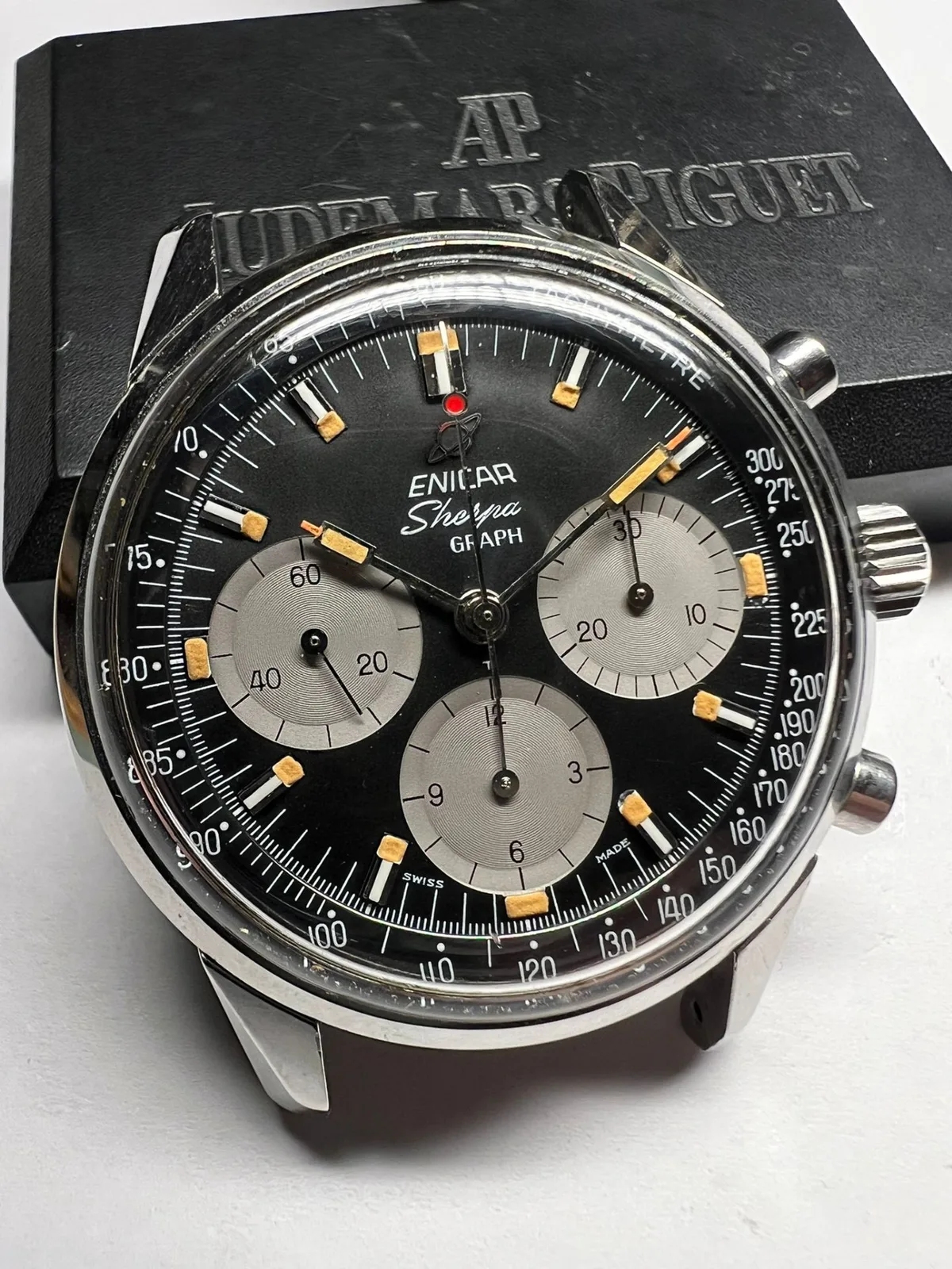 Sherpa Graph with a black dial, grey registers, orange-tipped paddle hands and a red-dot chronograph hand, without strap