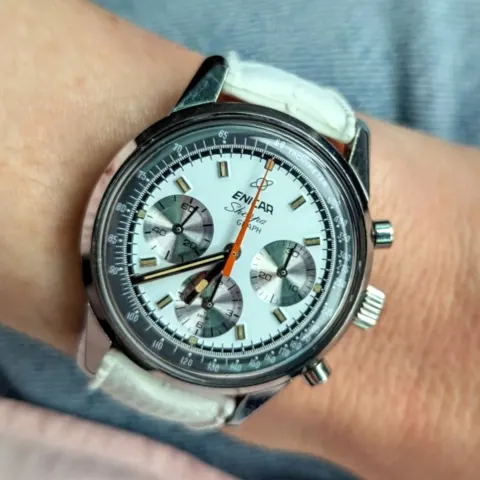 Sherpa Graph with a white dial, grey subdials and an orange chronograph hand on a white strap