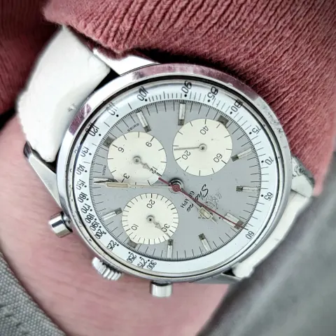 Sherpa Graph with a grey "Jim Clark" dial, white registers and silver tachymetre ring on a white strap, on the wrist