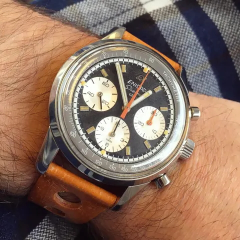 Sherpa Graph with a black dial and white registers on a tan rally strap, on the wrist