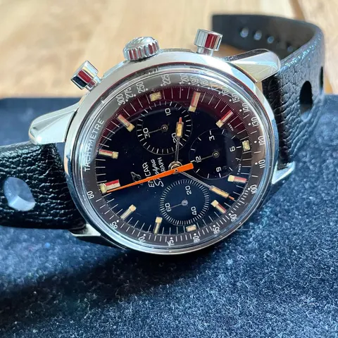 Sherpa Graph with an all black dial and orange chronograph hand on a black rally strap