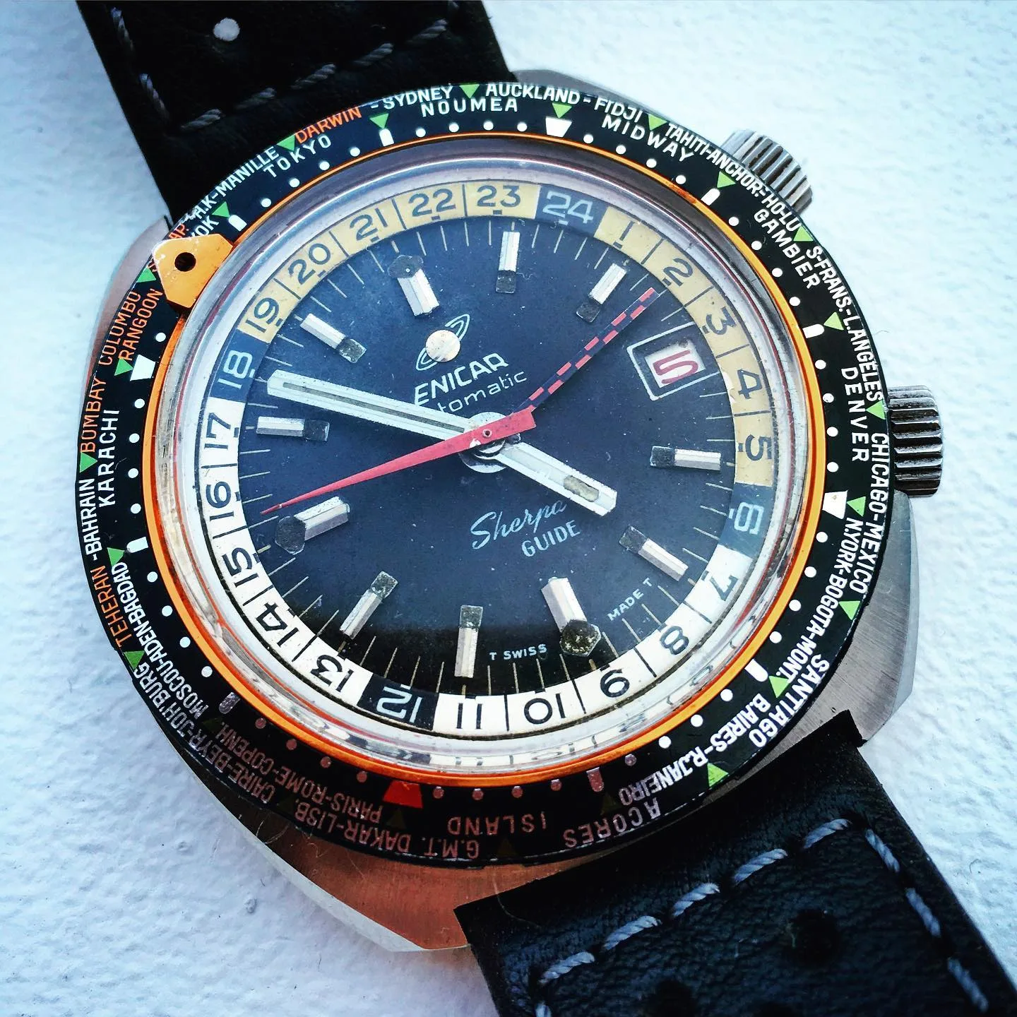 Sherpa Guide with a dark navy dial, cream inner 24-hour bezel and red GMT hand on a black strap