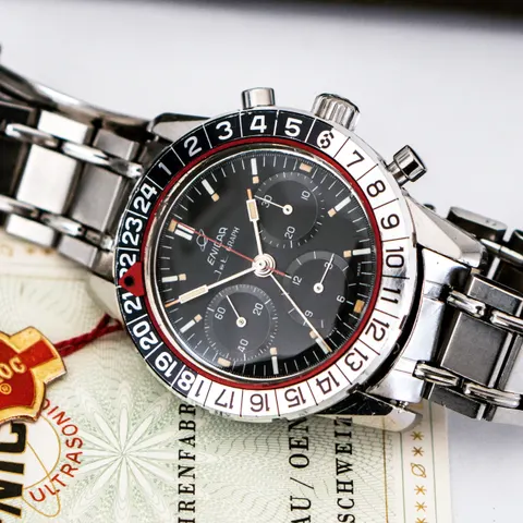 Jet Graph MkII with an all-black dial on a steel bracelet, lying on its guarantee