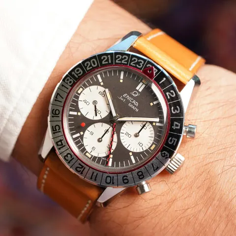 Jet Graph MkIII with a dark grey dial, white registers and 24-hour bezel on a tan strap, on the wrist