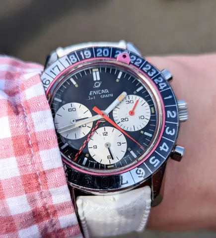 Jet Graph with a black dial, white registers and navy and silver 24-hour bezel on a white strap