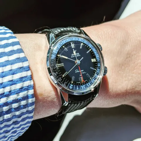 Sherpa Jet 33 with a black dial and blue and white 24-hour bezel on a black strap