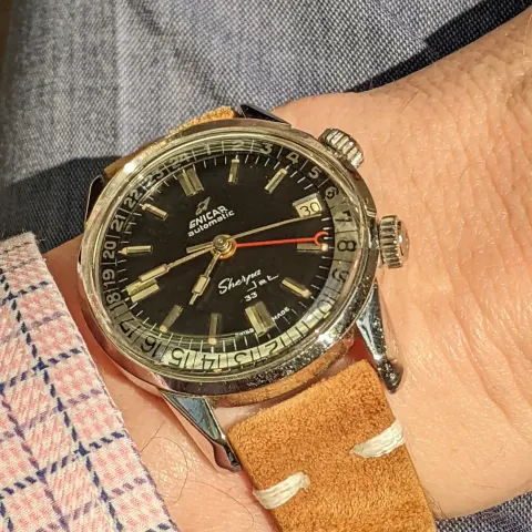 Sherpa Jet with a black dial and paddle hands on a tan suede strap