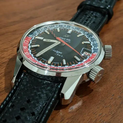 Sherpa Jet with a black dial and red and blue inner bezel on a black strap