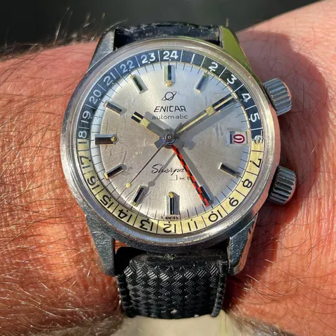 Sherpa Jet with a silver dial, black and cream inner bezel, red date and checkered GMT hand, on the wrist