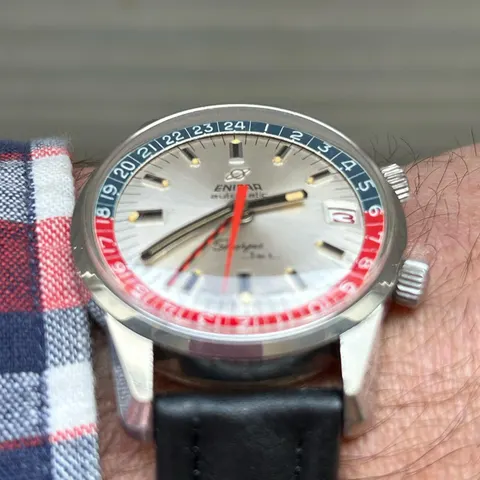 Close view of a Sherpa Jet with a silver dial and red and blue inner bezel