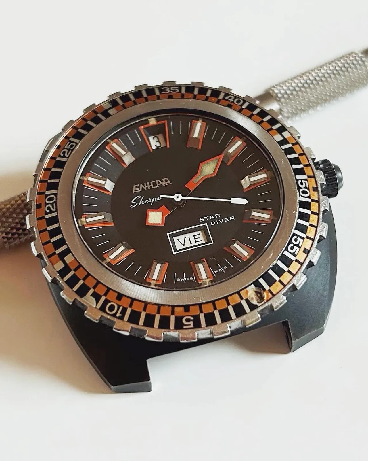 Sherpa Star Diver with a black dial, orange and black outer bezel and day-date, without strap