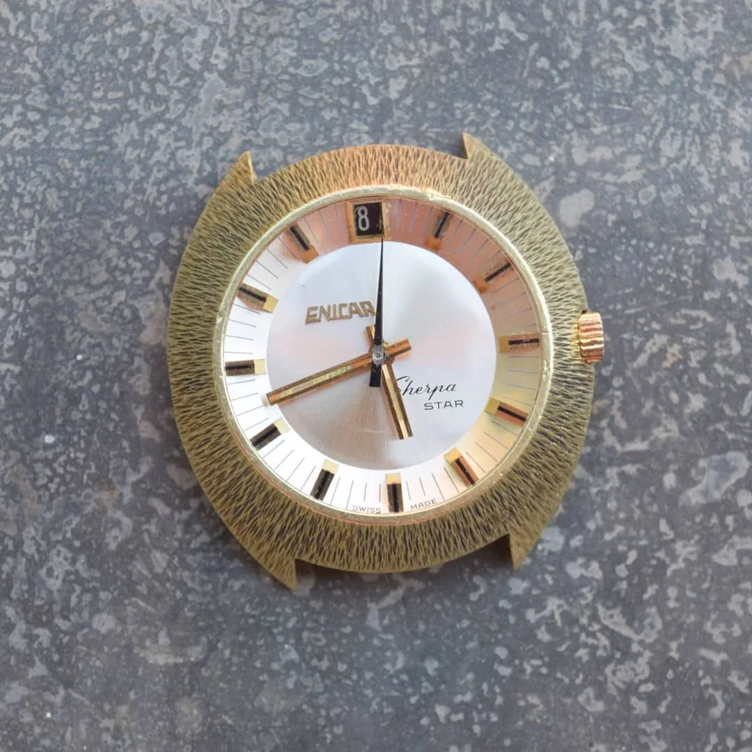 Sherpa Star with a silver dial in a gold-coloured textured case, without strap