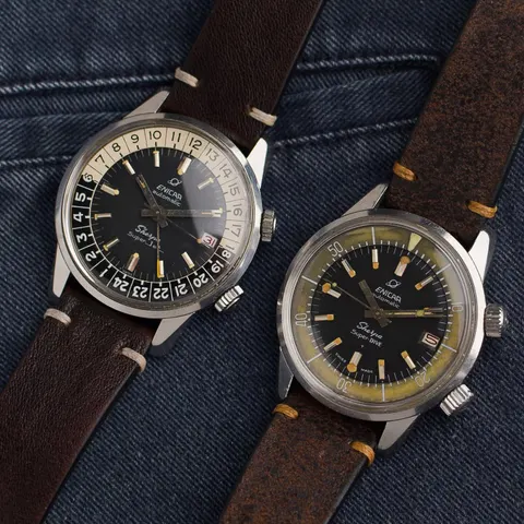 A Sherpa Super-Jet and a Sherpa Super-Dive side by side on brown leather straps, on denim