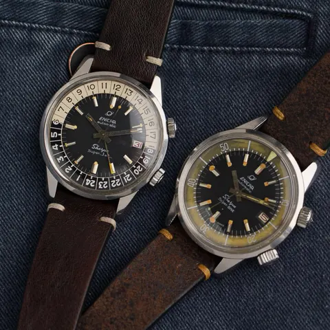 A Sherpa Super-Jet and a Sherpa Super-Dive side by side on brown leather straps, on denim