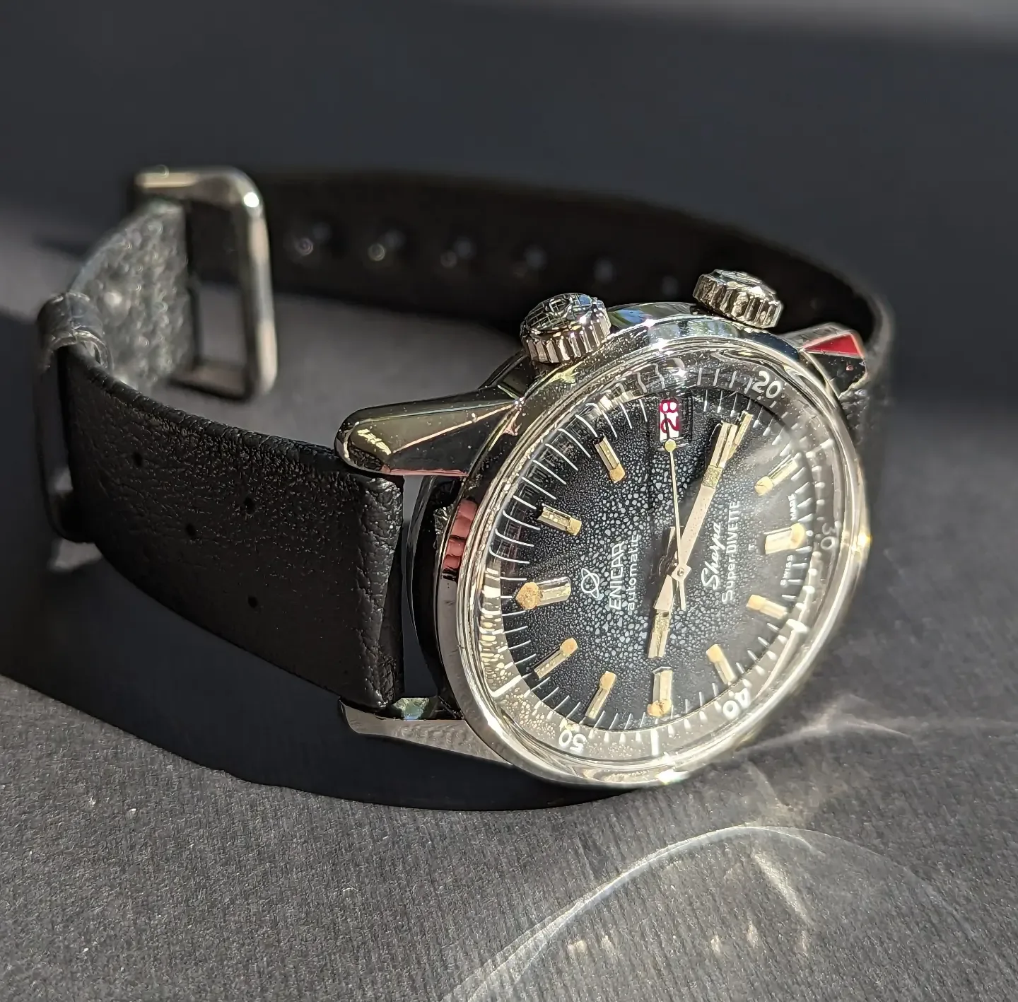 Sherpa Super-Divette with a black dial and two crowns on a black leather strap
