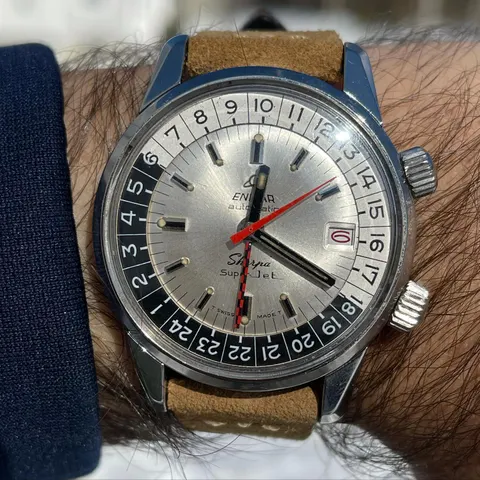 Sherpa Super-Jet with a silver dial and checkered GMT hand on a tan suede strap, on the wrist